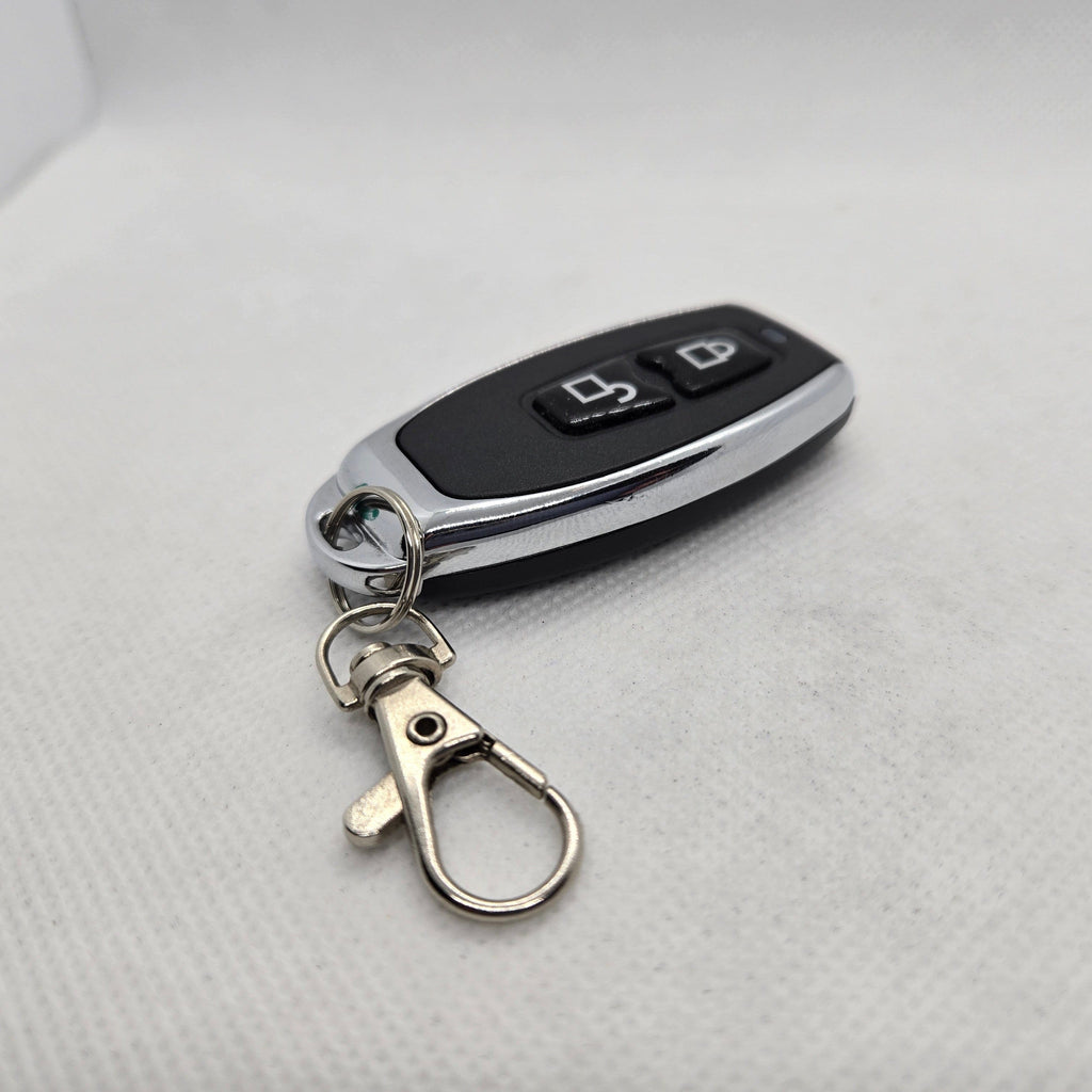 Key fob with remote control on a light gray background
