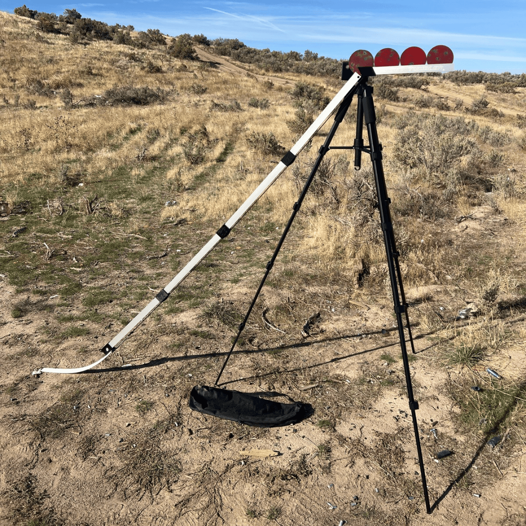Tripod with a target on a desert landscape under a blue sky